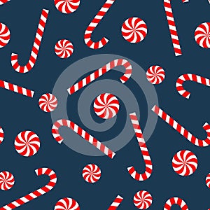 Seamless Christmas pattern with candy cane and lollipop.