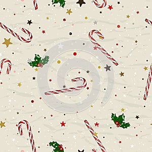 Seamless Christmas pattern with candy canes and holly berries from ink style collection.