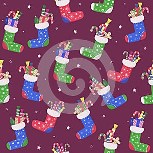 Seamless Christmas pattern. Colorful colored socks with gifts and sweet candy. Home decoration, place for New Year presents.