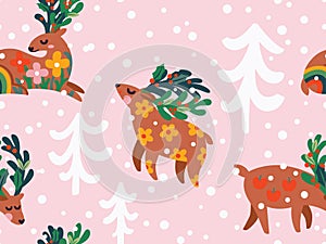 Seamless Christmas pattern with deers in the forest on pink background