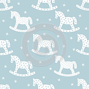 Seamless christmas pattern with rocking horses.