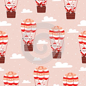 Seamless christmas pattern with santa claus and his wife flying on air ballon on pink background