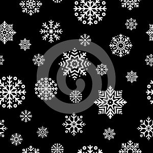 Seamless Christmas pattern with white snowflakes on black background. Winter decoration. Happy new year, cold season