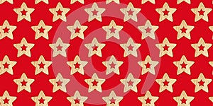 Seamless Christmas pattern with wooden decorative stars on a red background. Xmas abstract backdrop. Top view