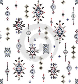 Seamless colored ethnic design on black background for textile prints.