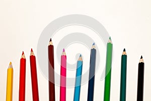 Seamless colored rainbow pencils row with wave on lower side, several arrangements, vector on white background isolated. Concept