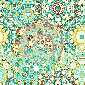 Seamless colorful ethnic pattern with mandalas in oriental style. Round doilies with blue, brown, green curls and swirls