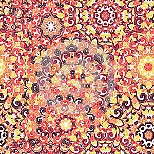 Seamless colorful ethnic pattern with mandalas in oriental style. Round doilies with yellow, orange, brown curls and swirls