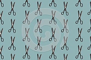 Seamless colorful pattern of Sewing Scissors on blue color background