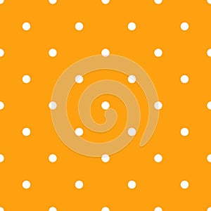 Seamless cute Halloween pattern with small white polka dots on orange background. Elegant holiday print for fabric textile