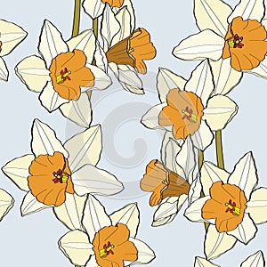 Seamless delicate pattern with spring flowers. Bright spring  daffodils illustration on blue background.