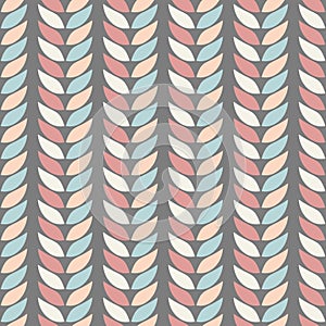 Seamless geometric background patterns of leaves in pastel colours on a background of graphite