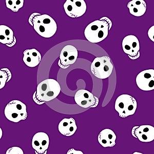 Seamless Halloween skull pattern on purple background