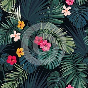 Seamless hand drawn tropical vector pattern with hibiscus flowers and exotic palm leaves on dark background.