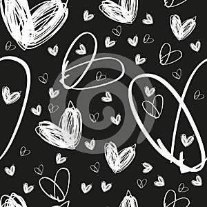 Seamless hand drawn white heart texture on black background
