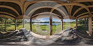 360 seamless hdri panorama view on wooden table next to benches inside gazebo near river or lake in autumn in equirectangular