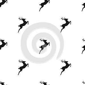 Seamless hunting pattern with black silhouette of jumping deer with antlers