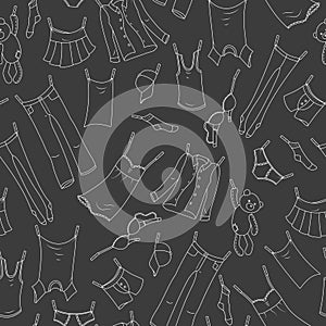 Seamless illustration on the theme of washing and cleanliness, various clothes , a light contour icons on dark background