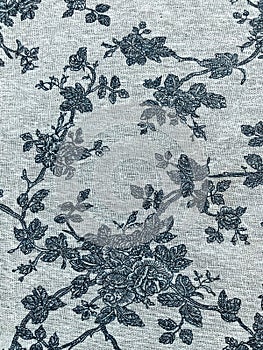 Fragment of retro tapestry textile pattern with floral ornament useful as background.