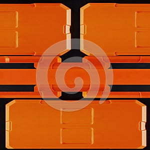 Seamless 4k photo texture material of orange and black plastic tech panel surface