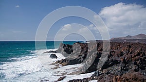 Seamless loop, View of the ocean and cliffs on Timanfaya national park of Lanzarote, Canary Islands, Spain- Video HD