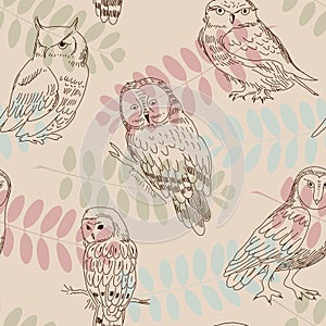 Seamless ornament with wild owls on a background of tree branches