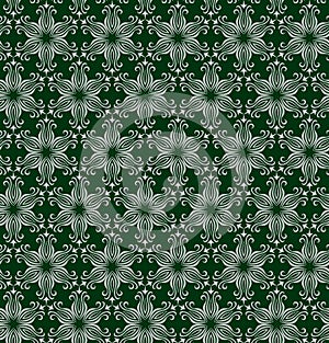 Seamless ornate pattern with abstarct silver flowers or snowflakes on dark grren background in vector. Print for fabric, wrapping