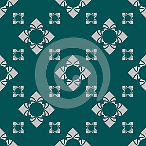 Seamless paisley pattern on green background