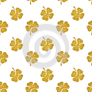 Seamless pattern of abstract four-leaf clovers of gold glitter