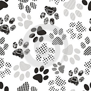 Seamless pattern with animal paw prints. Complex illustration print in black and white.