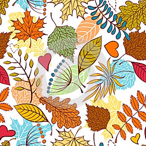 Seamless pattern with autumn leaves and hearts