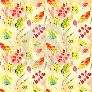 Seamless pattern of autumn yellow, red, orange, green leaves on a textured yellow orange background. graphic color picture