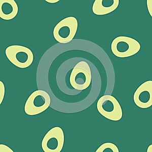 Seamless pattern with avocado halves on green background. Vector illustration in minimalist style. Simple trendy print