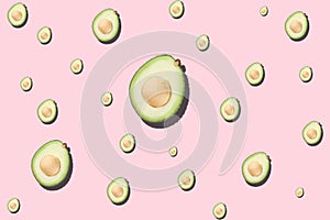 Seamless pattern avocado on light pink background