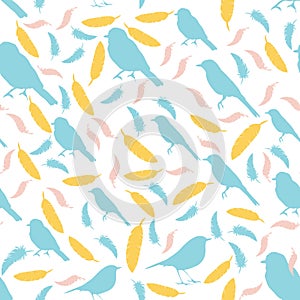 Seamless pattern with birds and feathers. colored silhouettes of birds and feath