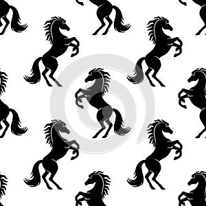 Seamless pattern with black horses.
