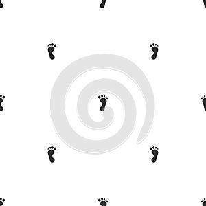 Seamless pattern with black human feet and foot step. Bare footprints. Footstep shape silhouette ornament. Sand trace