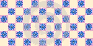 Seamless pattern with blue cornflowers on checked pink yellow background, vector