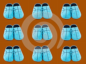Seamless pattern of blue Slippers on a brown background.