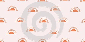 Seamless pattern with bright suns on a light background