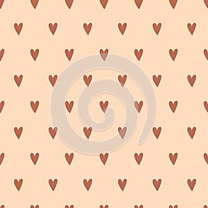 Seamless Pattern of Brown Hearts on a Beige Background