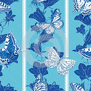 Seamless pattern with butterflies and flowers in blue and white colors.