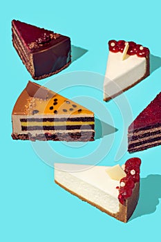 Seamless pattern of cake slices with different flavor.Chocolate, blueberry, mint berry, raspberry, jelly, blackberry, limon.