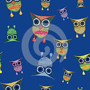 Seamless pattern with cartoon multicolored owls on blue background. Kids wallpaper, stationery, packaging, print, textile, design.