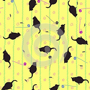 Seamless pattern of cats, mice and balls on a yellow wallpaper background with flowers.