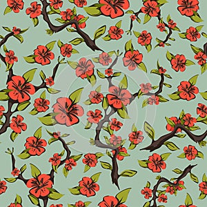 Seamless pattern of cherry blossoms. Abstract bright orange flowers on a branch with leaves on a pale green background