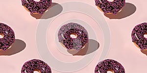 Seamless pattern: chocolate 3D donut on a beige background is a realistic sweet dessert with a top. 3D rendering