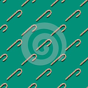 Seamless pattern of Christmas candy cane on green background