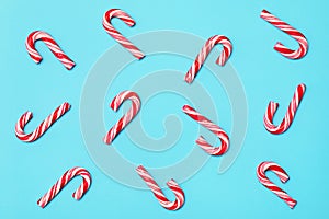 Seamless pattern from christmas candy canes, festive design paper