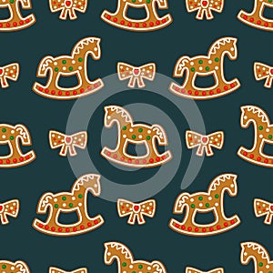 Seamless pattern with Christmas gingerbread cookies - rocking horses and bows.